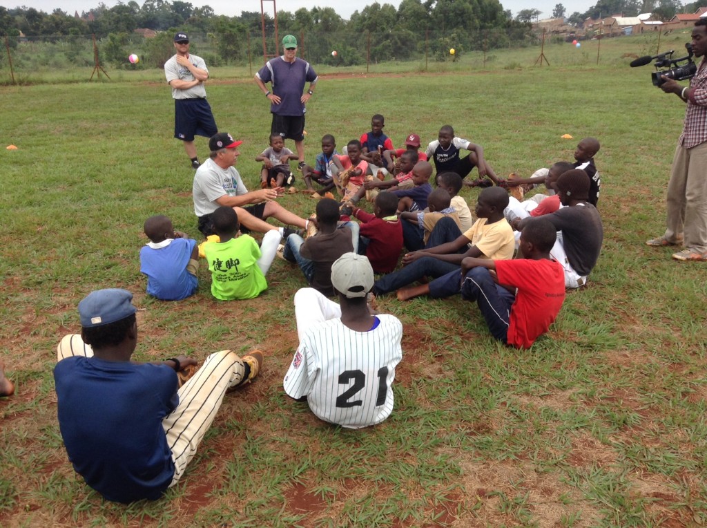 Youth baseball clinic with coach addressing group