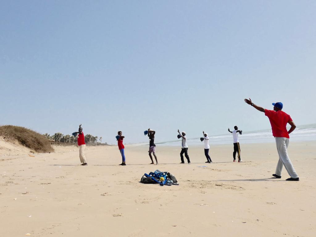 Beach baseball training in Gambia