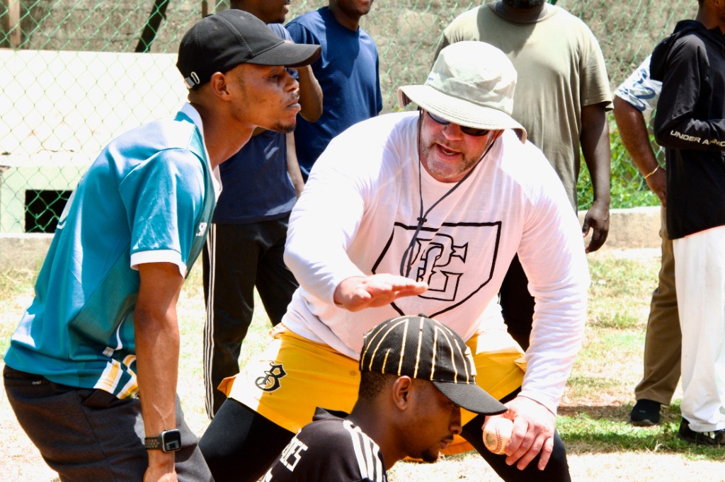 Coach providing instruction during Play Global training