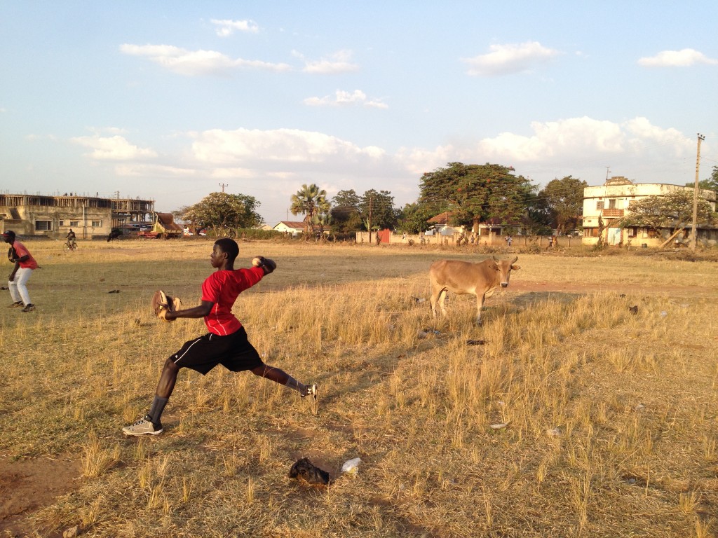 Youth pitcher practicing baseball in Soroti, Uganda